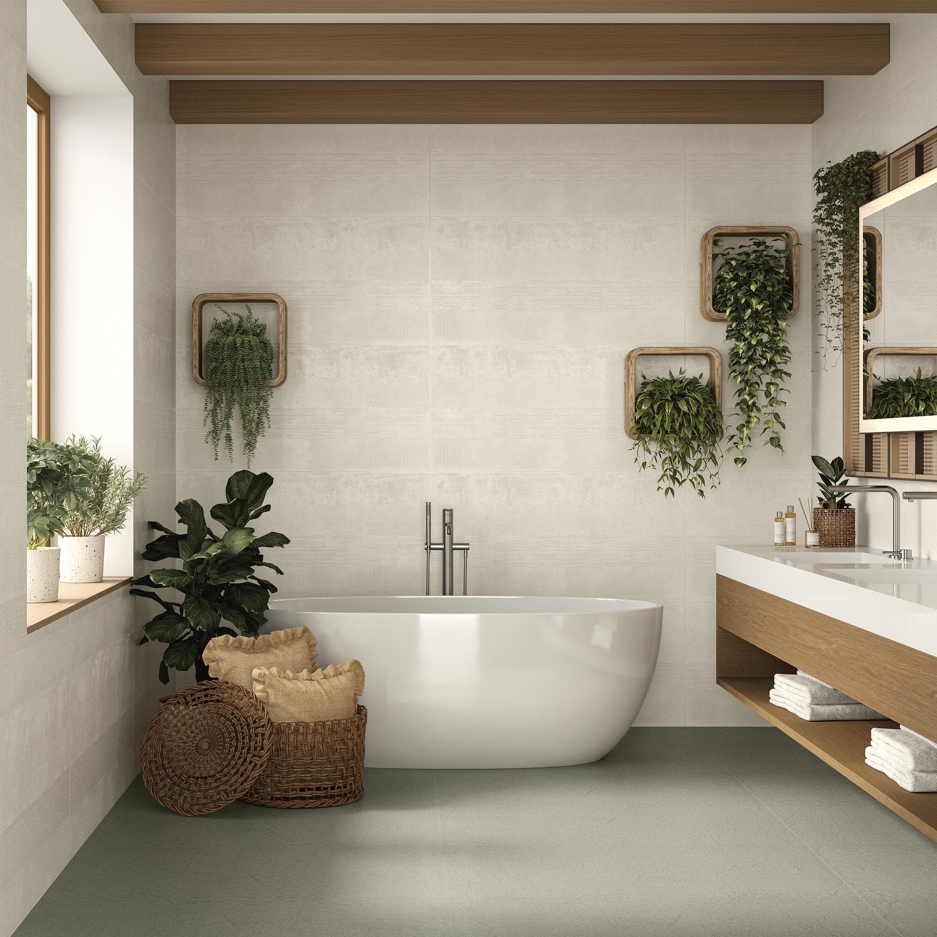 Bagno con vasca freestanding e pareti color crema Bagno con vasca freestanding, pareti lucide color crema e pavimento grigio-verde, piante e mobile lavabo in legno